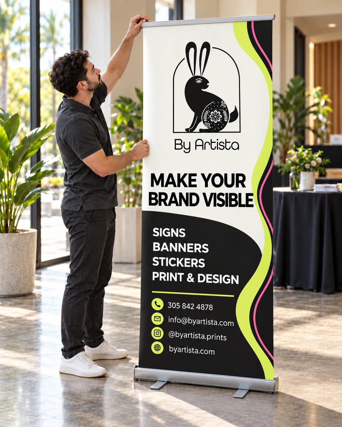 Mockup of a By Artista pastel retractable banner being assembled